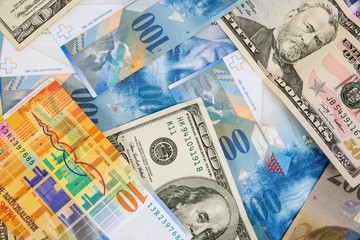 USD and CHF banknotes as background