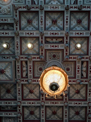 old chandelier on pattern ceiling