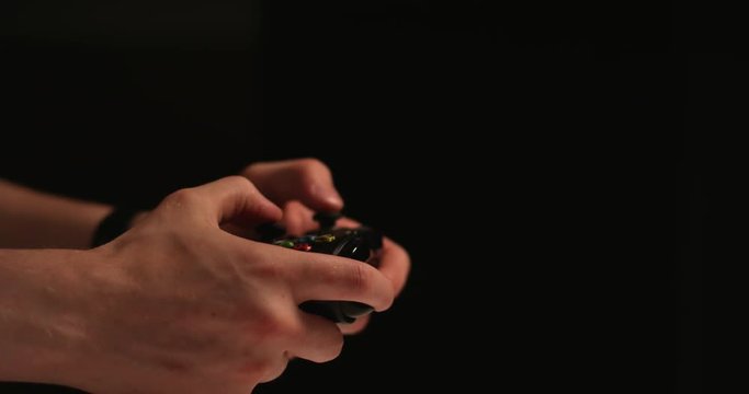Man hands playing video games- 120fps slow motion- isolated with copy space