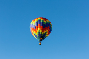 Hot air balloons in the air at a festival