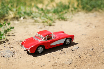 Fototapeta na wymiar Close up of toy car on ground