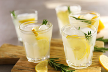 Cold fresh cocktails with lemon on cutting board