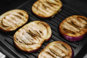 Grilled eggplant on baking tray, closeup