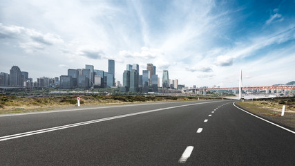 cityscape and skyline of chongqing from empty asphalt road