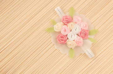beautiful artificial flower on dry noodle  background