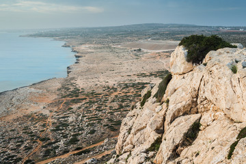 Fototapeta na wymiar Lonely bench on the coast. Cape Cavo Greco. Cyprus