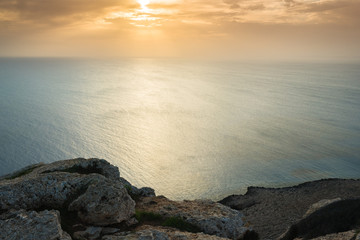Fototapeta premium Lonely bench on the coast. Cape Cavo Greco. Cyprus