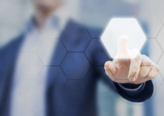 Person touching an hexagonal button on a digital interface