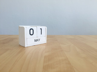 May 1st.May 1 white wooden calendar on vintage wood abstract bac