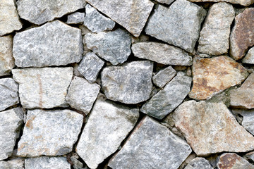 old stone wall Texture in weathered and have natural surfaces.