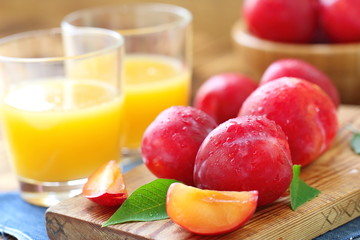 Plum juice and ripe fresh fruit