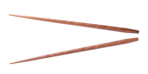 Wooden pairs of chopsticks on white background