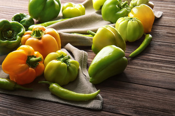 Fresh peppers on wooden table
