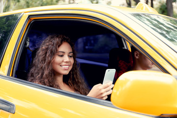 Beautiful girl in taxi car