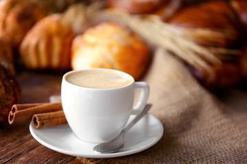 Cup of coffee and different bakery products