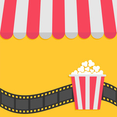 Popcorn. Film strip. Cinema icon. Striped store awning for shop, marketplace, cafe, restaurant. Red white canopy roof. Flat design. Yellow background. Isolated.