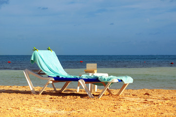sun chair on the sandy beach 