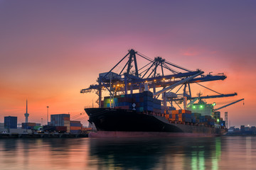 Cargo ship terminal at twilight scene, Unloading crane of cargo