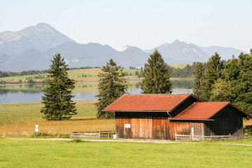 tyical farm by an alpin lake 