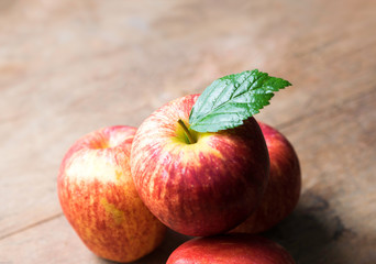 group of red apple on wood table, red apple background for good
