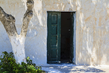 Typical old house and old door in the village of Oia on Santorini island in Greece. 