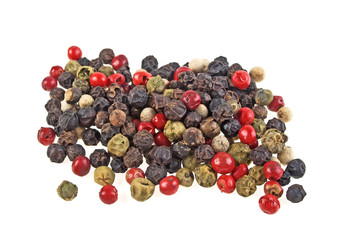 Heap of various pepper peppercorns seeds mix on white background
