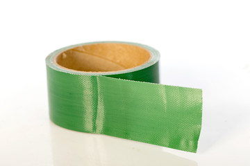green sticky tape roll on white background