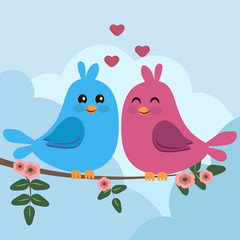 two colorful birds sitting on a branch