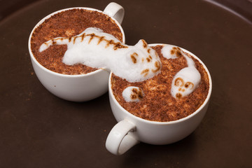 Coffee with foam in the form of cat and mouse