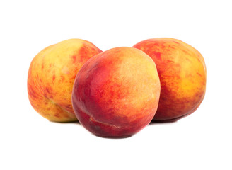 Three fresh peaches