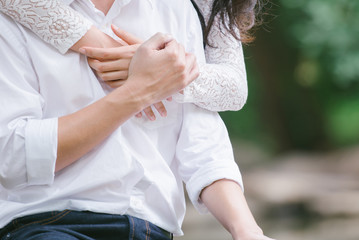 Romantic couple hugging on nature background