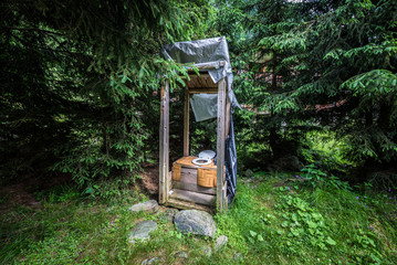 outhouse next to Transfagarasan Road in southern section of Carpathian Mountains in Romania © Fotokon