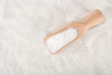 scoop on white sugar top view