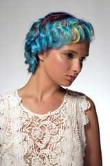 Fototapeta premium Portrait of a tender girl with dyed hair, professional hair colouring and hairstyle