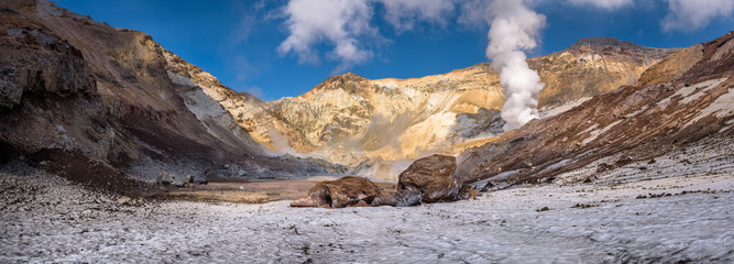 Big rocks on the eternal snow inside Mutnovsky volcano crater, Kamchatka, Russia © nielsvos