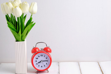 Flower and alarm clock.