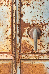 Rusty old door with peeling paint