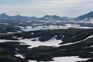 Fototapeta na wymiar Top of Vilyuchinskaya volcano and mountain lake from Gorely Volcano, Kamchatka, Russia