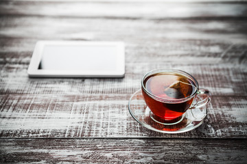 red tea with a tablet on a table in an office