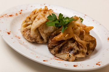 stuffed pancakes decorated with parsley