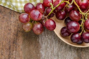 Fresh grape on old wooden table  background