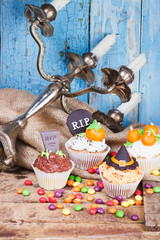 Halloween cupcakes with colored decorations