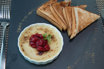  delicious Creme Brulee with cherry filling and bread