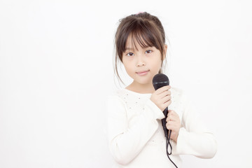 Pretty little asian girl with the microphone in her hand High ke