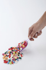 Many colorful pills isolated on white background