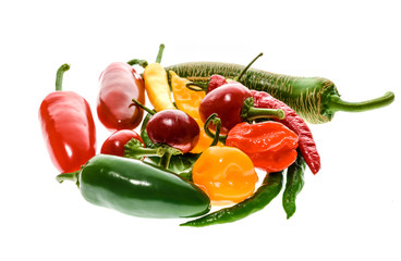 Different variety of hot peppers or chilies, isolated on white.
