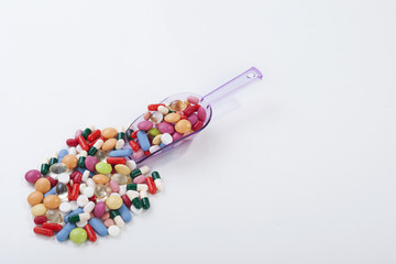 Fototapeta na wymiar Many colorful pills isolated on white background