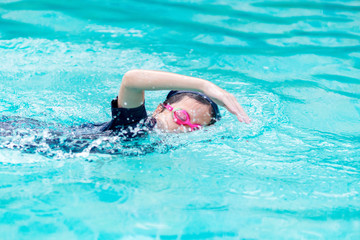 Girl swimming in the pool