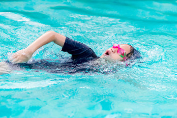 Girl swimming in the pool