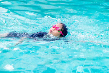 Girl swimming in the pool